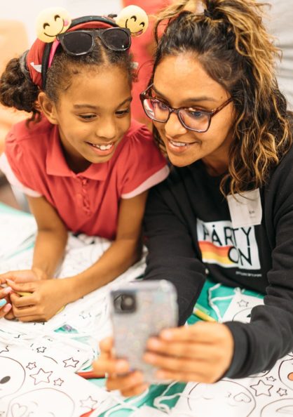 two girls looking at phone