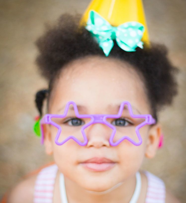 child with star glasses